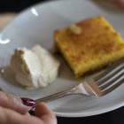 A dessert with whipped cream on a plate.
