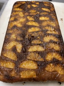 A pineapple cake sitting on a counter.