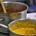 Two pans full of sauce.