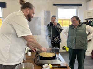 A chef doing a cooking demonstration.